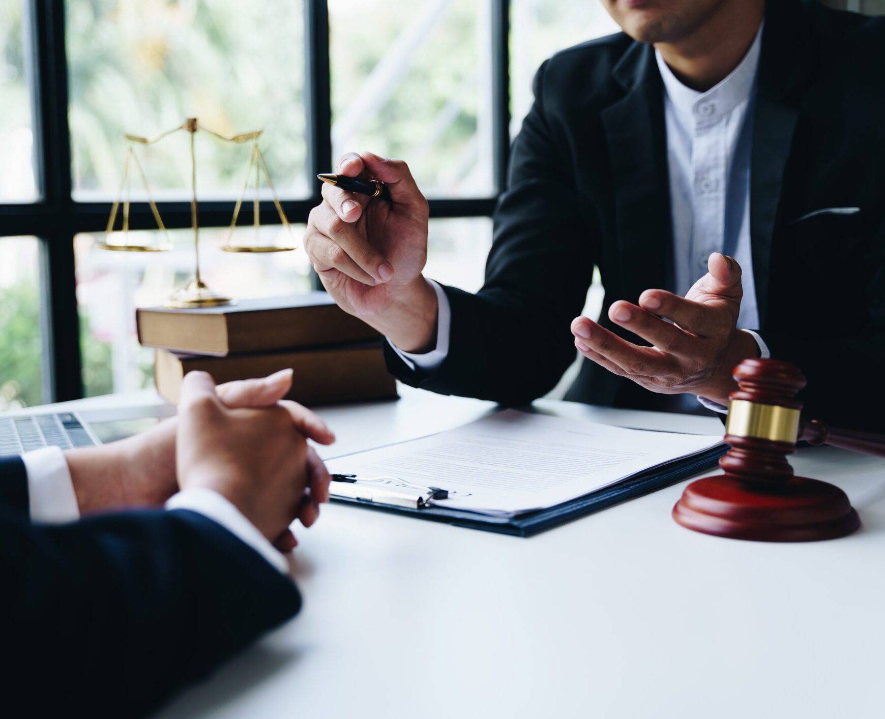 Consultation of Businesswoman and Male lawyer or judge counselor having team meeting with client, Law and Legal services concept.