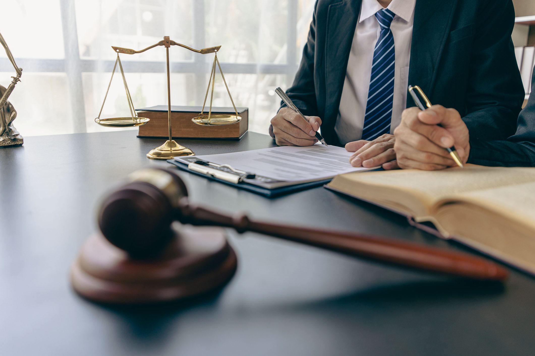 legal advisory office Lawyer in with hammer, symbol of justice Lawyer businessman working or reading law book in workplace for lawyer consulting concept